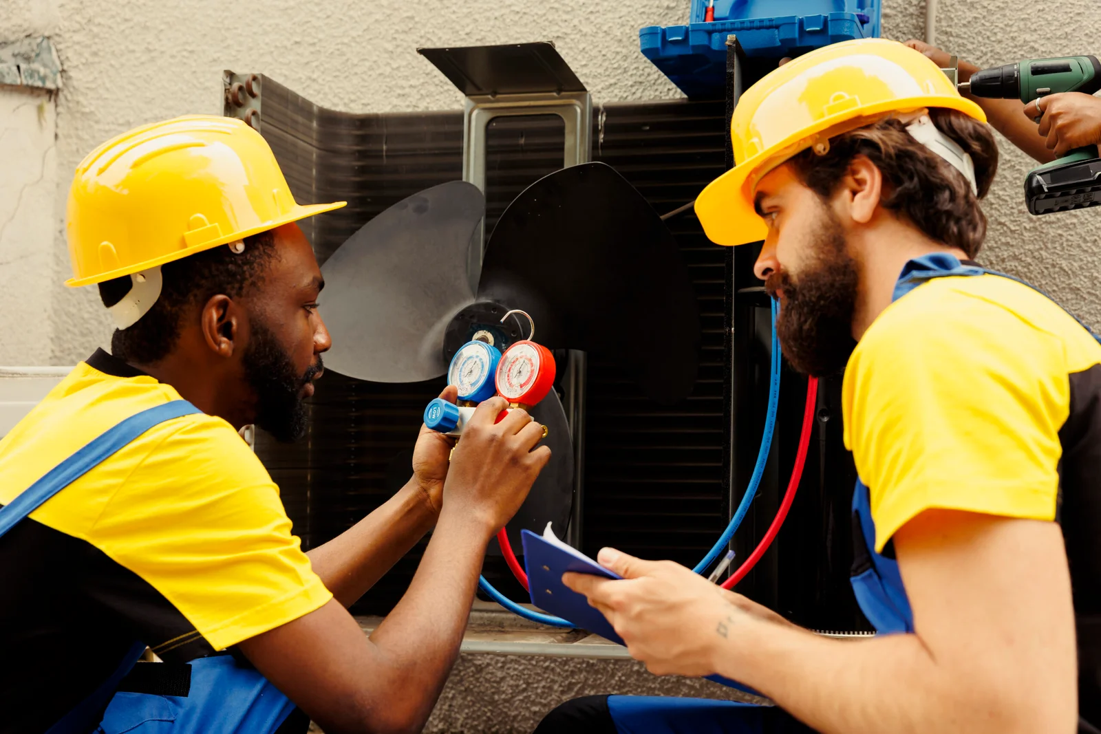 meticulous-wiremen-expertly-refilling-freon-external-air-conditioner-while-using-manifold-measurement-device-closely-measure-pressure-hvac-system-ensuring-perfect-cooling-performance-scaled